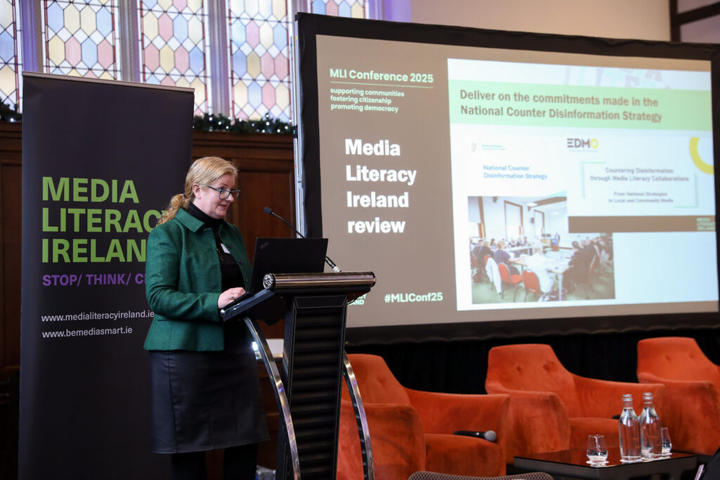 Photo of Martina Chapman, MLI National Coordinator at podium.