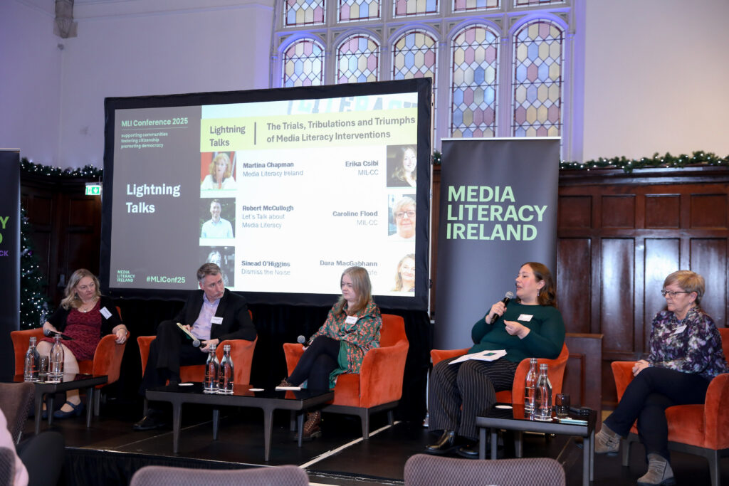 Five panellists seated.