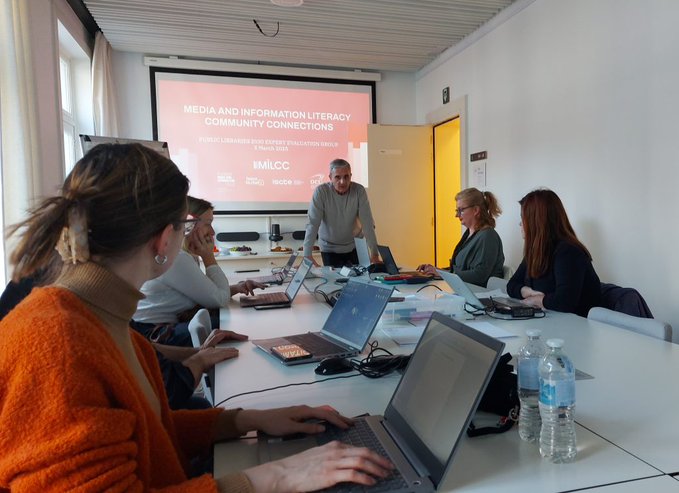 People listening to a presentation