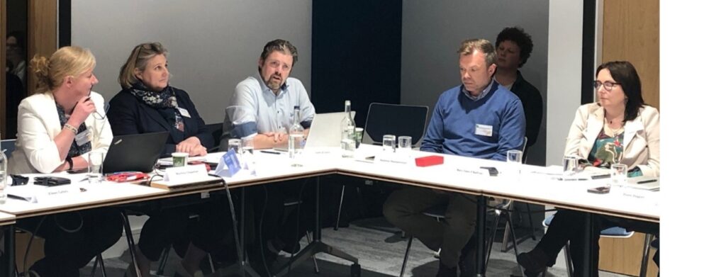 Martina Chapman, Stephanie Comey, John Evans, Seamus Hempenstall, Mary Clare O’Sullivan seated at a table at the Disinformation Forum